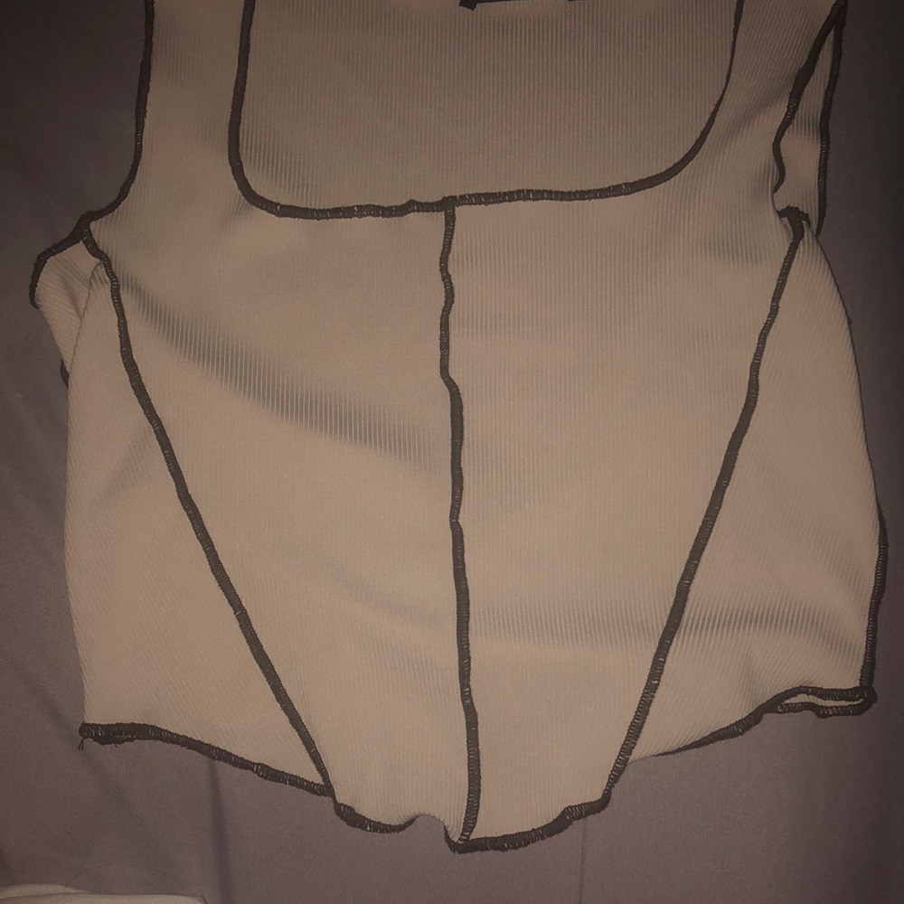 tan cropped shirt with brown outlined